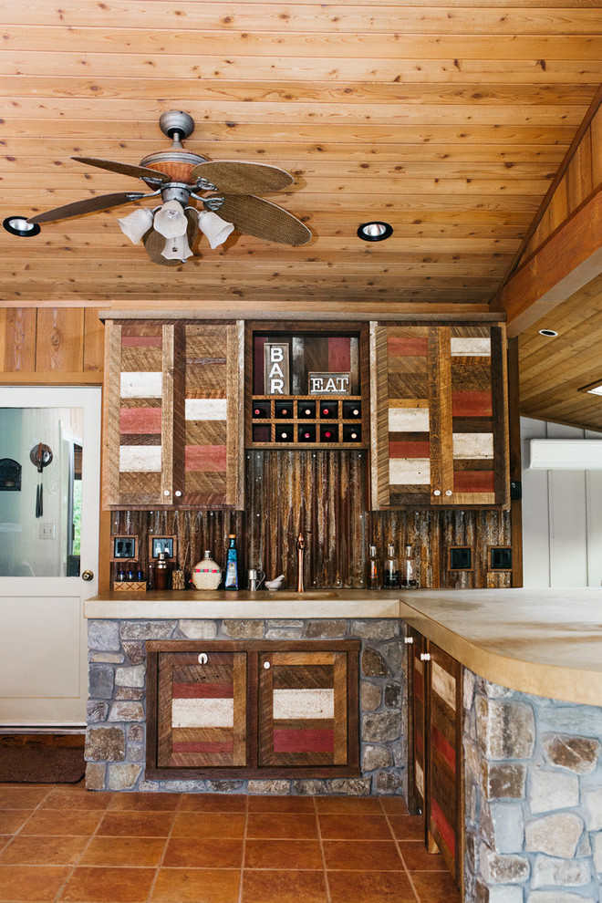 Eat-in kitchen - mid-sized rustic l-shaped ceramic tile and beige floor eat-in kitchen idea with an integrated sink, shaker cabinets, medium tone wood cabinets, brown backsplash, wood backsplash and a peninsula