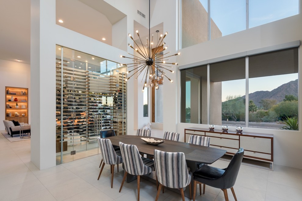 Photo of a mid-sized contemporary open plan dining in Phoenix with white walls, porcelain floors and no fireplace.