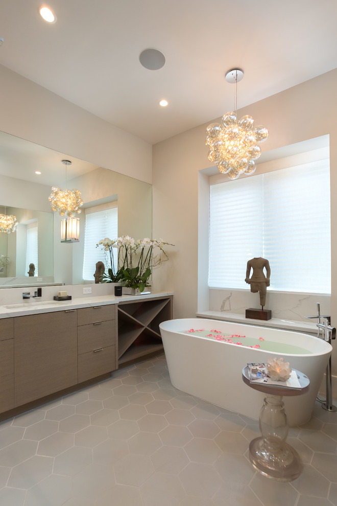 Inspiration for a large contemporary master bathroom in San Francisco with flat-panel cabinets, beige cabinets, an open shower, a one-piece toilet, beige walls, ceramic floors, marble benchtops and grey floor.