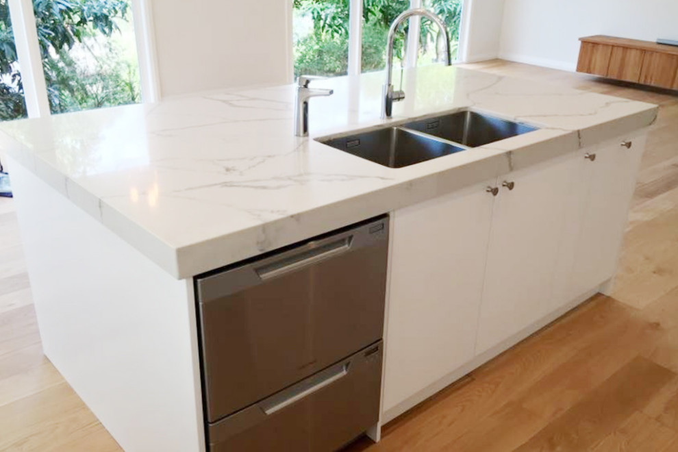Inspiration for a mid-sized contemporary galley eat-in kitchen in Sydney with louvered cabinets and with island.