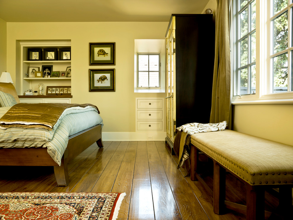 This is an example of a traditional bedroom in Chicago with yellow floor.