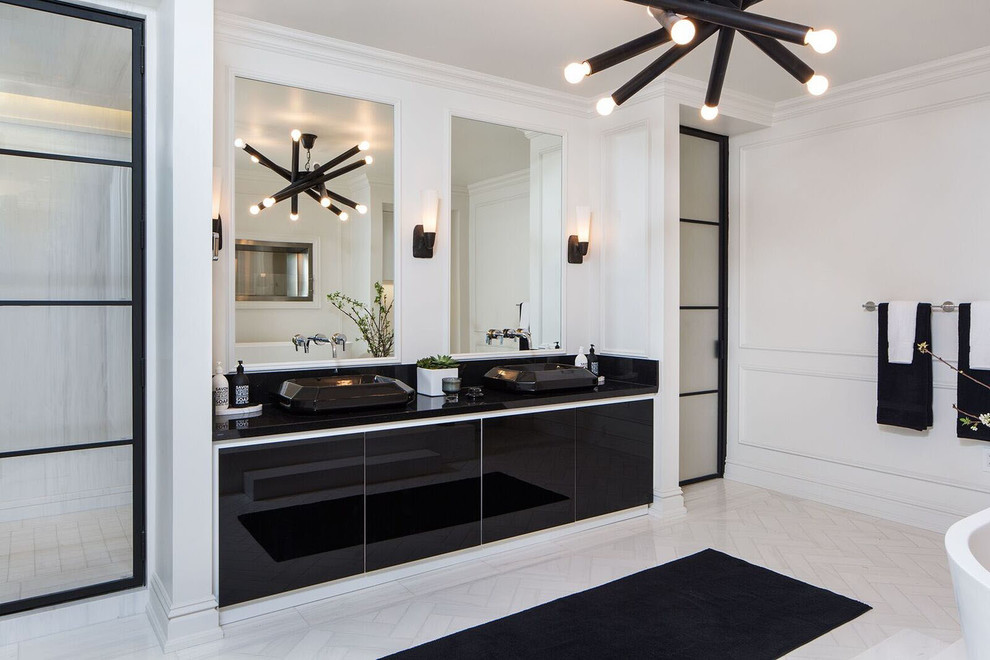 Photo of a transitional master bathroom in Los Angeles with flat-panel cabinets, black cabinets, white walls, a vessel sink and white floor.