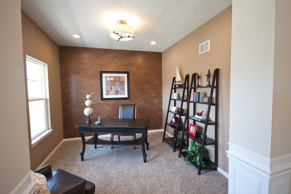 This is an example of a mid-sized transitional study room in Chicago with beige walls, carpet, a freestanding desk and beige floor.