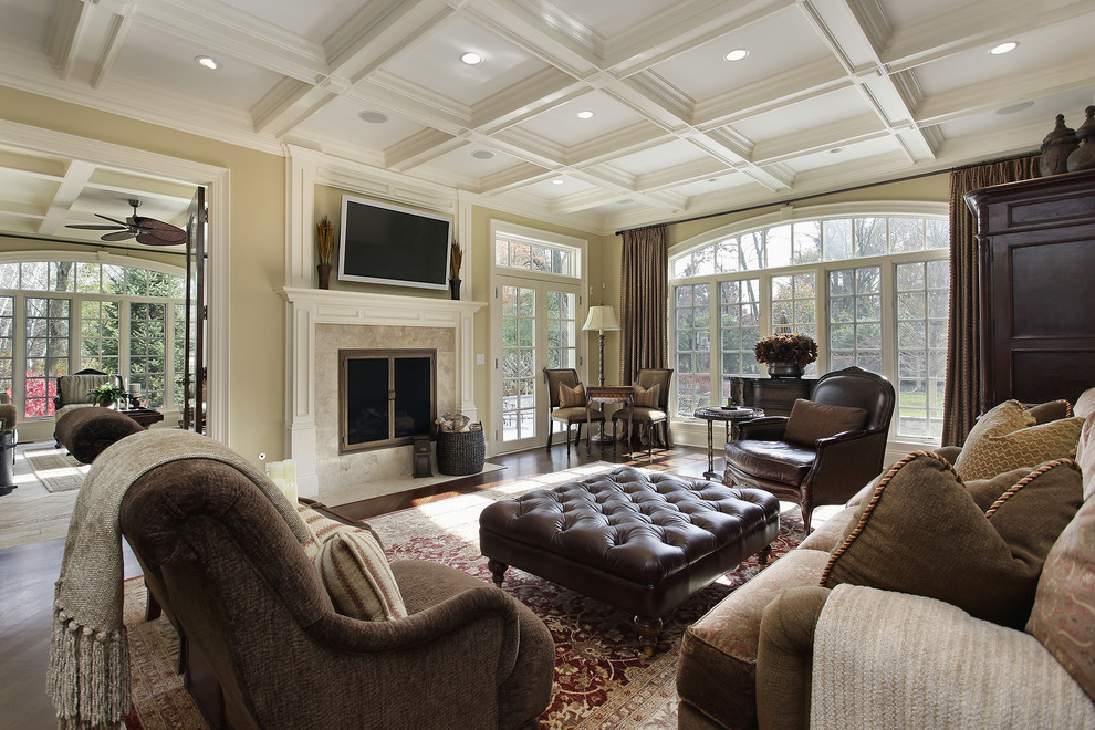 Example of a huge transitional formal and open concept medium tone wood floor living room design in Seattle with beige walls, a standard fireplace, a stone fireplace and a wall-mounted tv