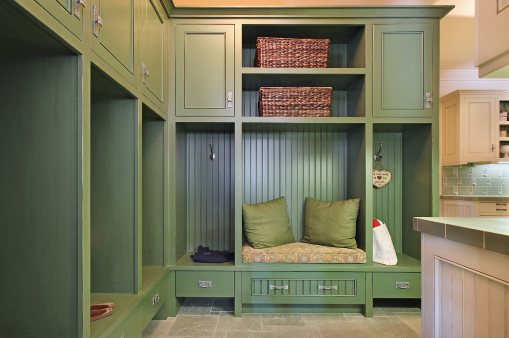 Mid-sized arts and crafts mudroom in San Diego with green walls, grey floor and limestone floors.