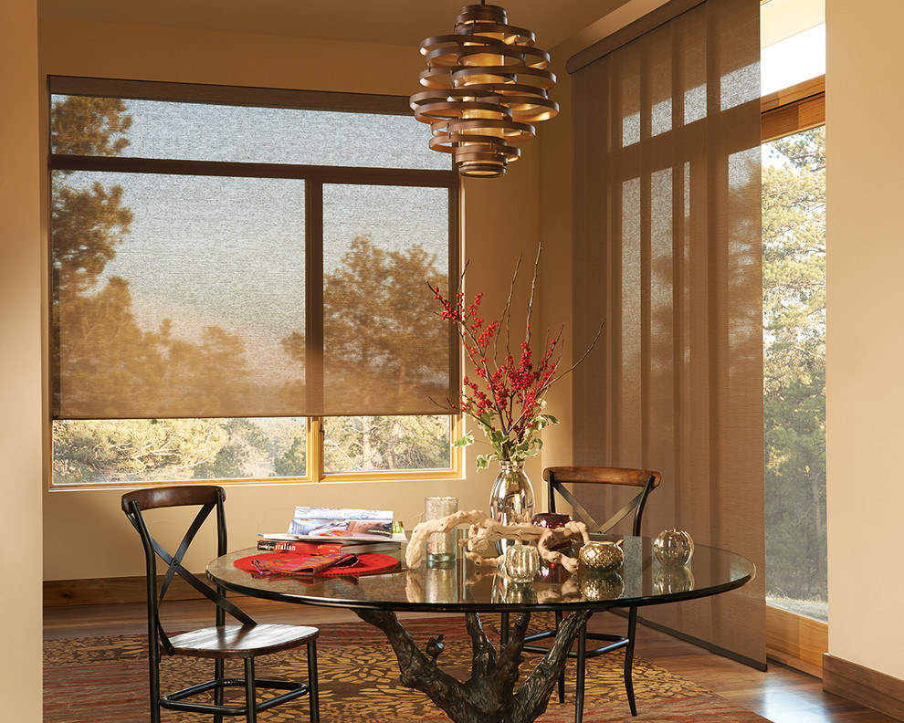 This is an example of a transitional dining room in Phoenix with dark hardwood floors and brown floor.