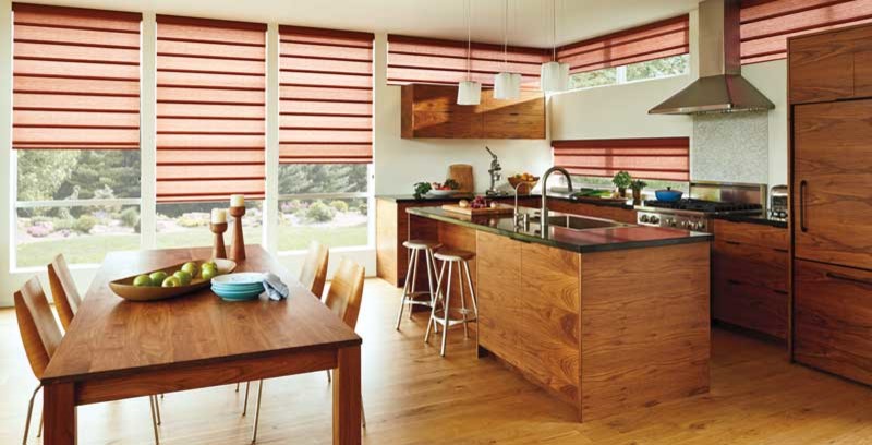 Inspiration for a mid-sized transitional u-shaped medium tone wood floor open concept kitchen remodel in Edmonton with a drop-in sink, flat-panel cabinets, medium tone wood cabinets, solid surface countertops, gray backsplash, mosaic tile backsplash, stainless steel appliances and an island