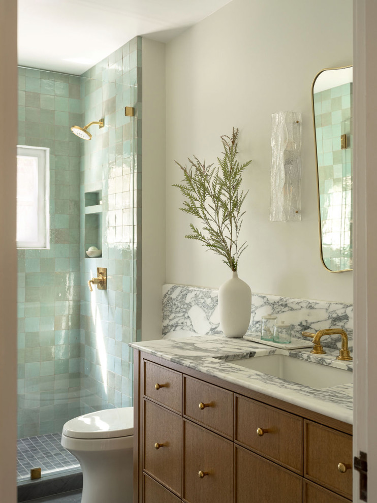 Transitional blue tile and mosaic tile single-sink bathroom photo in San Francisco with medium tone wood cabinets, beige walls, marble countertops, white countertops, a niche and a freestanding vanity