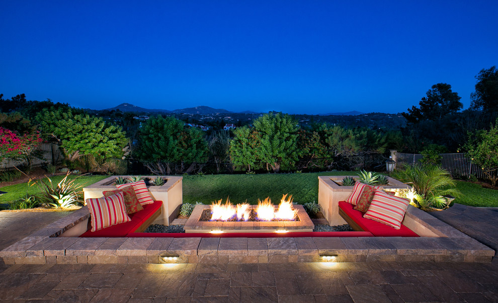 This is an example of a mediterranean patio in San Diego with a fire feature.