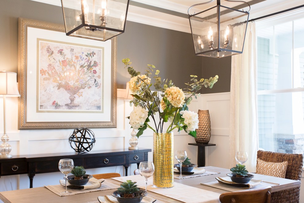 This is an example of a transitional dining room in Richmond with grey walls.