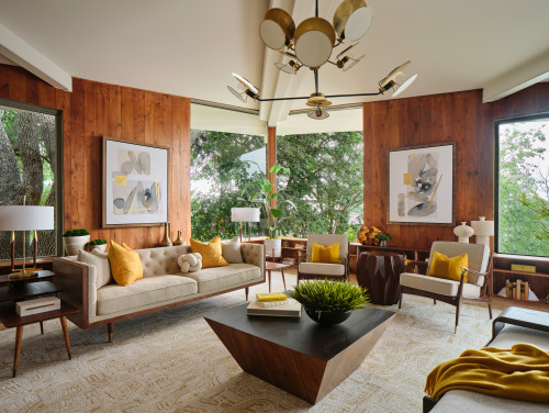 Mustard Yellow to Warm Up a Wood-Paneled mid century modern living Room
