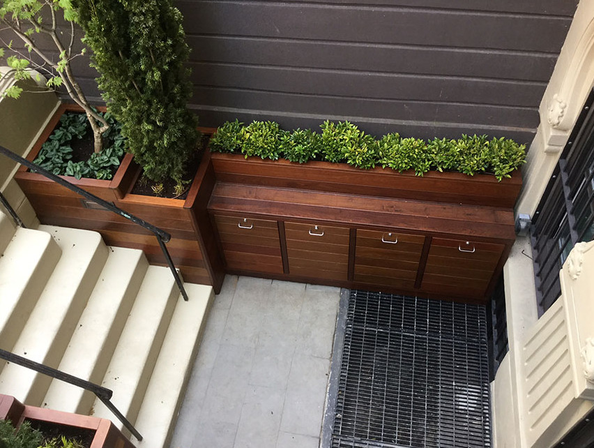This is an example of a mid-sized contemporary rooftop deck in New York with an outdoor kitchen and no cover.