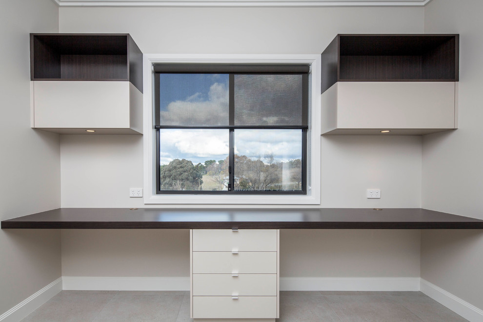 Design ideas for a mid-sized contemporary study room in Canberra - Queanbeyan with a built-in desk.