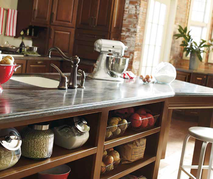 Kitchen - large transitional light wood floor kitchen idea in Denver with raised-panel cabinets, medium tone wood cabinets, stainless steel appliances and an island