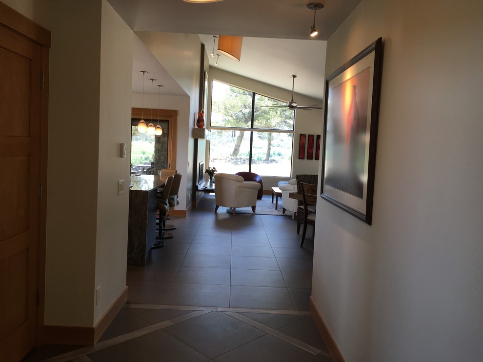 Inspiration for a mid-sized transitional porcelain tile foyer remodel in Denver with a medium wood front door