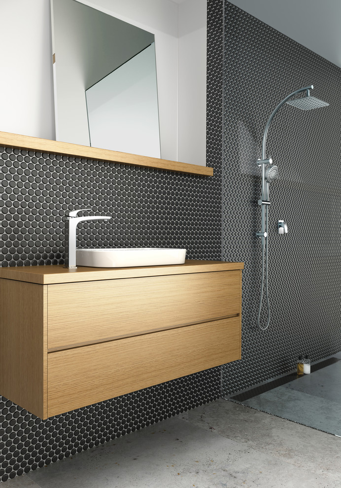 Photo of a mid-sized modern bathroom in Melbourne with a vessel sink, medium wood cabinets, wood benchtops, an open shower and black tile.