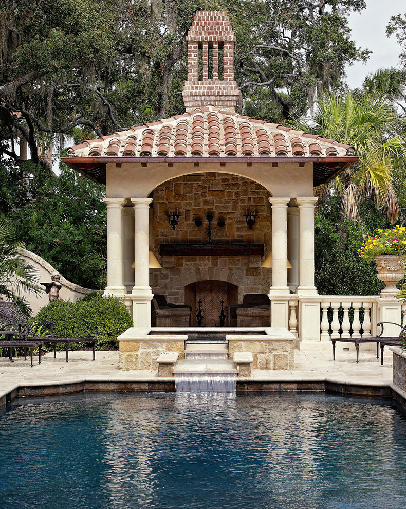 Inspiration for an expansive mediterranean backyard patio in Other with a water feature, natural stone pavers and a gazebo/cabana.