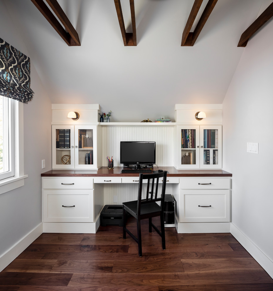 Inspiration for a transitional built-in desk dark wood floor home office remodel in Seattle with gray walls