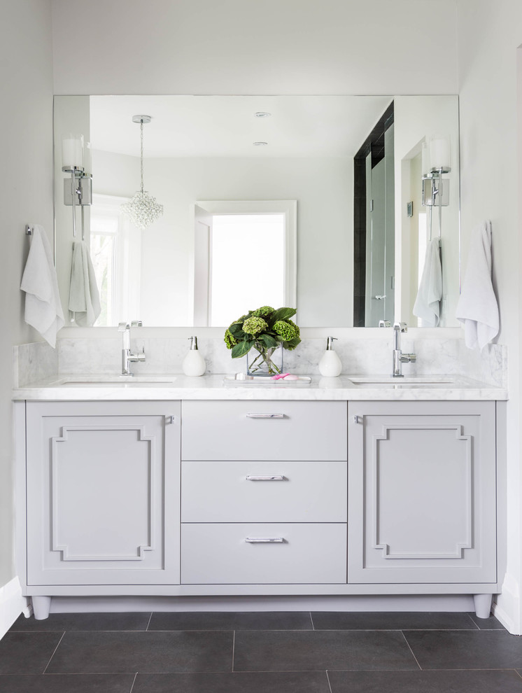 Mid-sized transitional master bathroom in Toronto with an undermount sink, grey cabinets, grey walls, marble benchtops, gray tile, marble floors and flat-panel cabinets.