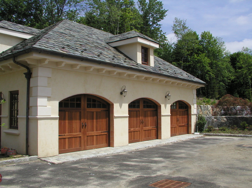 This is an example of an expansive mediterranean attached three-car carport in New York.