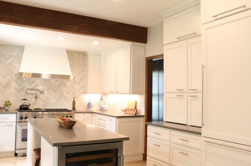 Example of a mid-sized u-shaped ceramic tile, beige floor and exposed beam eat-in kitchen design in Denver with a single-bowl sink, flat-panel cabinets, white cabinets, quartz countertops, gray backsplash, marble backsplash, stainless steel appliances, an island and gray countertops