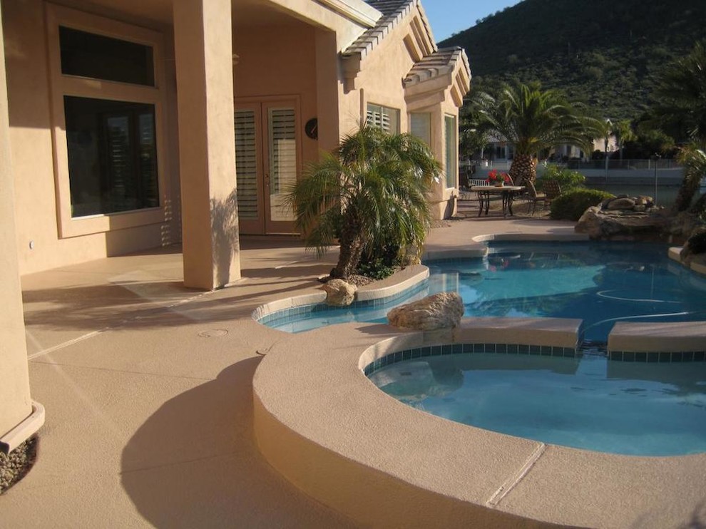 Inspiration for a small backyard custom-shaped pool remodel in Phoenix