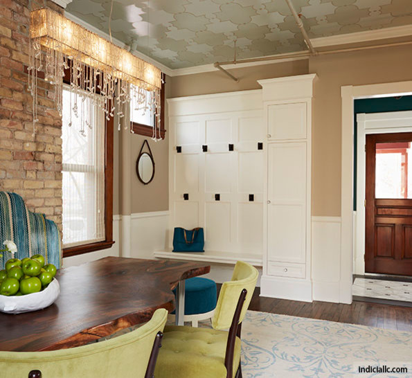 Design ideas for a midcentury entryway in Detroit with dark hardwood floors and brown floor.