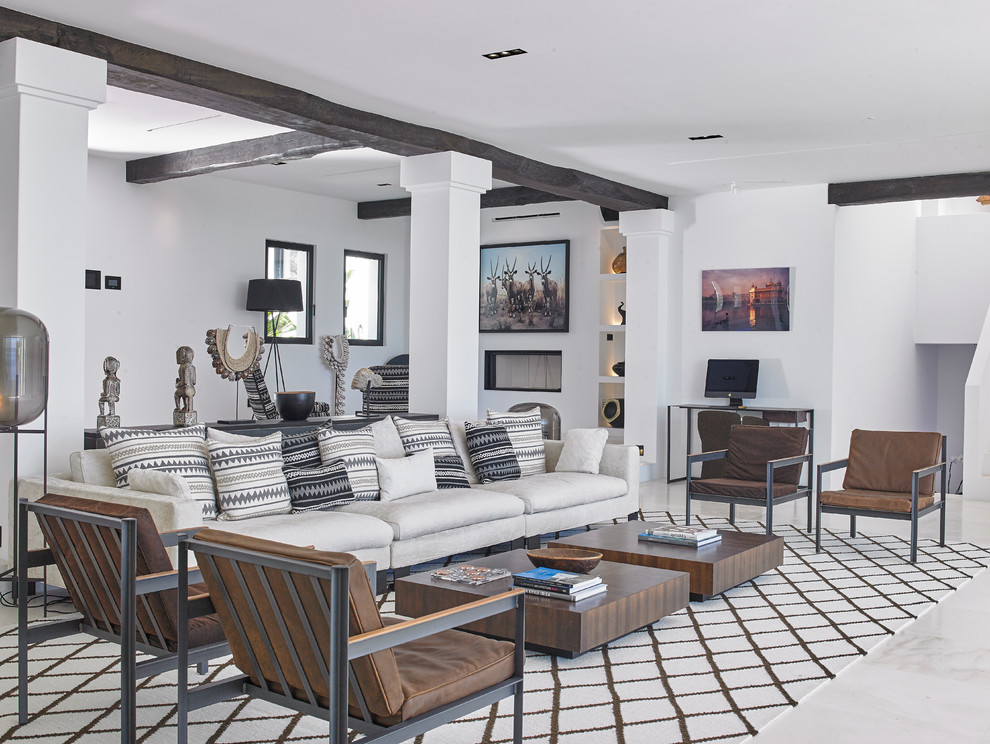 Photo of a contemporary living room in Other with white walls and white floor.