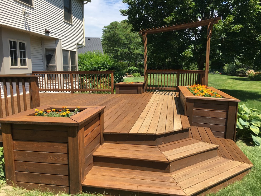 Mid-sized transitional backyard deck in New York with a container garden and no cover.