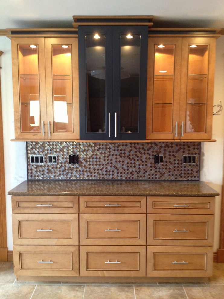 Mid-sized transitional l-shaped eat-in kitchen photo in New York with recessed-panel cabinets, light wood cabinets, quartz countertops, metallic backsplash, mosaic tile backsplash, stainless steel appliances and an island