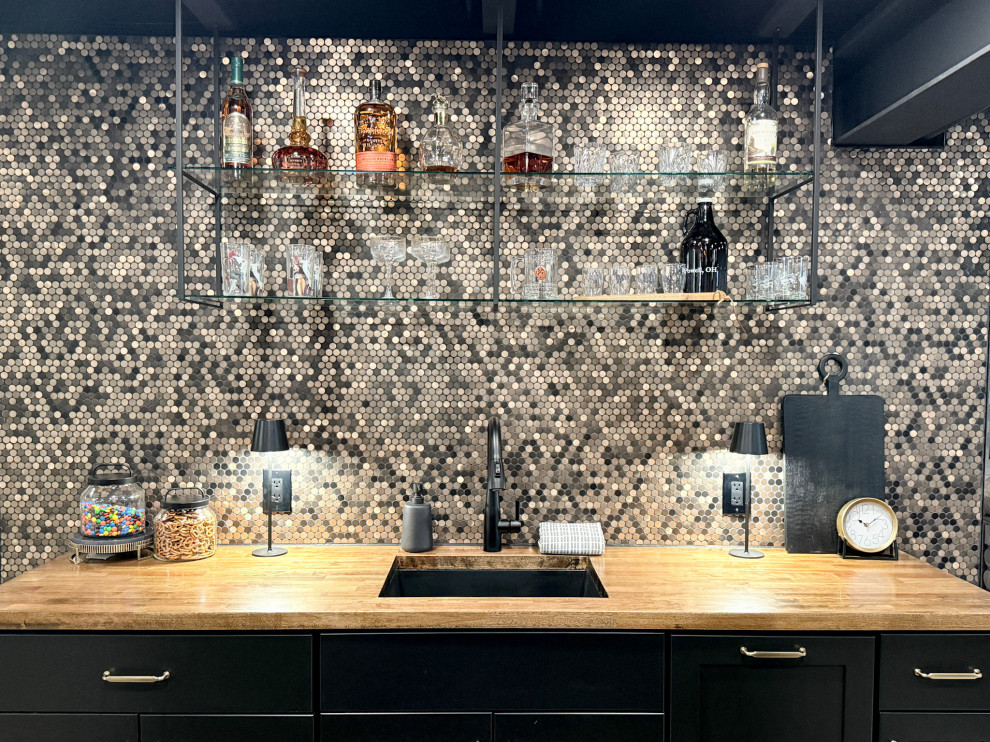 Bar with penny tile, butcher block top, and custom iron and glass shelves.