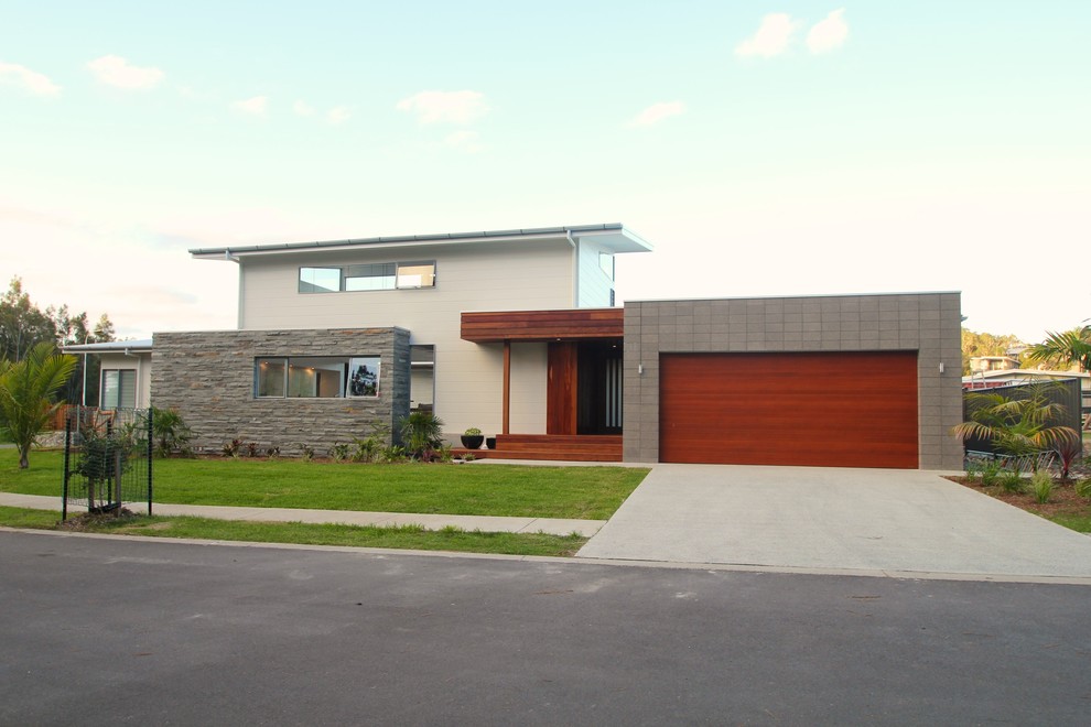 This is an example of a large contemporary two-storey exterior in Sydney.