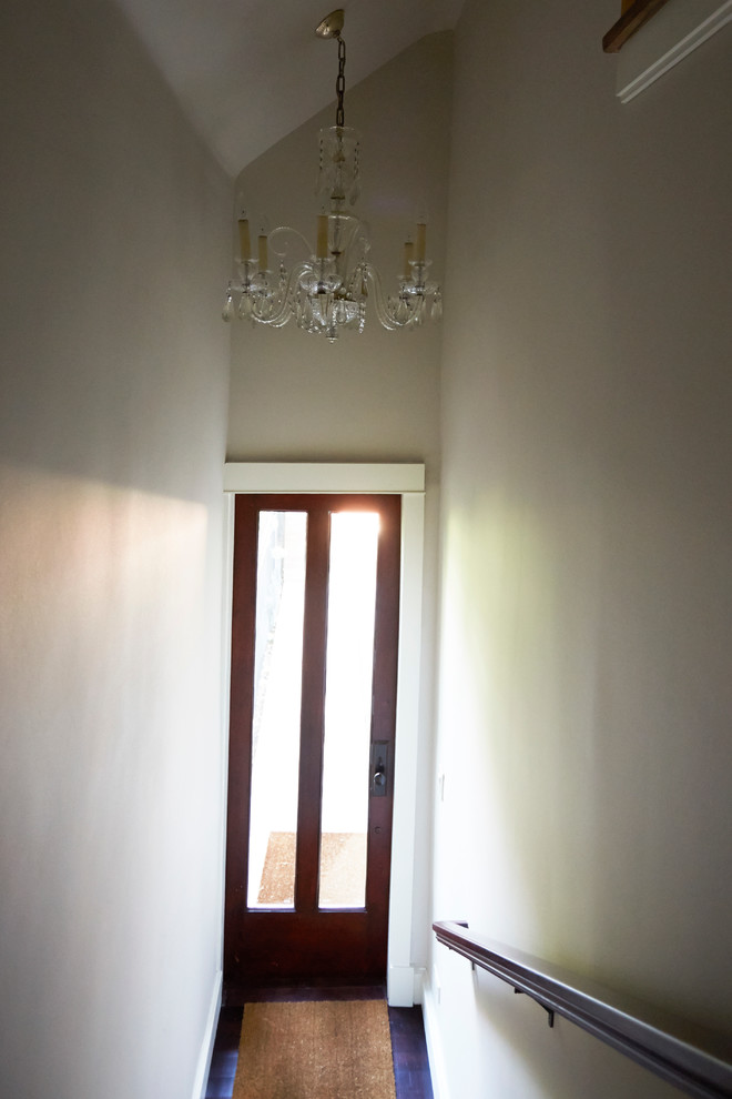 Transitional dark wood floor foyer photo in Chicago with gray walls and a brown front door