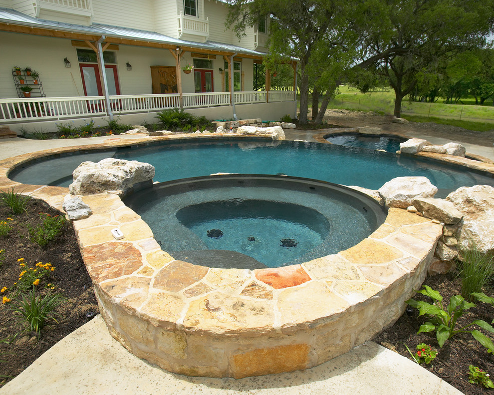 Large mountain style courtyard concrete and custom-shaped natural home design photo in Austin
