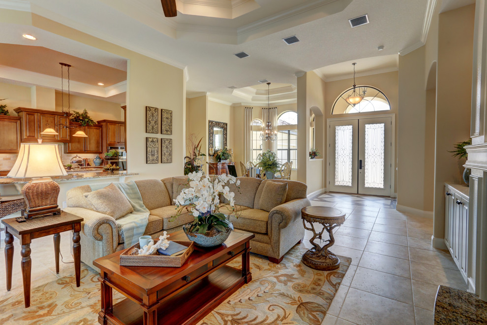 Inspiration for a large transitional open concept family room in Orlando with yellow walls, ceramic floors, a wall-mounted tv, beige floor, a ribbon fireplace and a tile fireplace surround.
