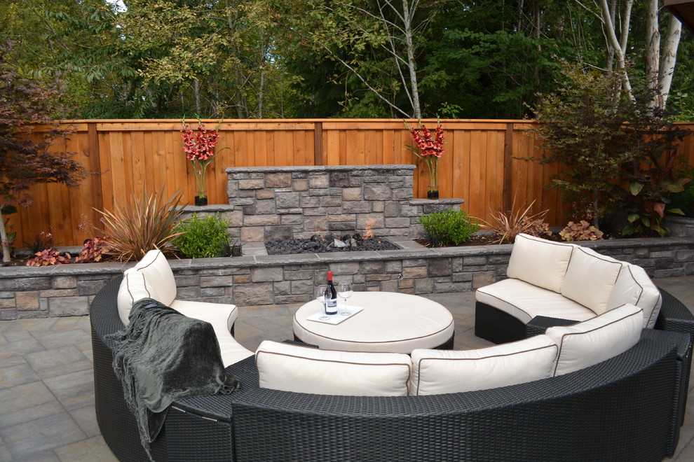 This is an example of a traditional patio in Portland with a fire feature and no cover.