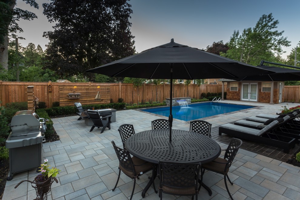 This is an example of a transitional backyard landscaping in Toronto.