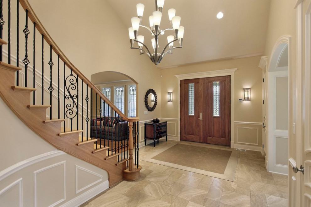 This is an example of a classic wood curved wood railing staircase in Chicago with wood risers.