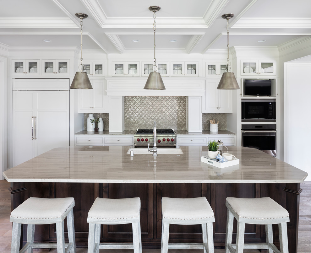 Inspiration for a beach style kitchen in Minneapolis with shaker cabinets, white cabinets, metallic splashback, panelled appliances and with island.