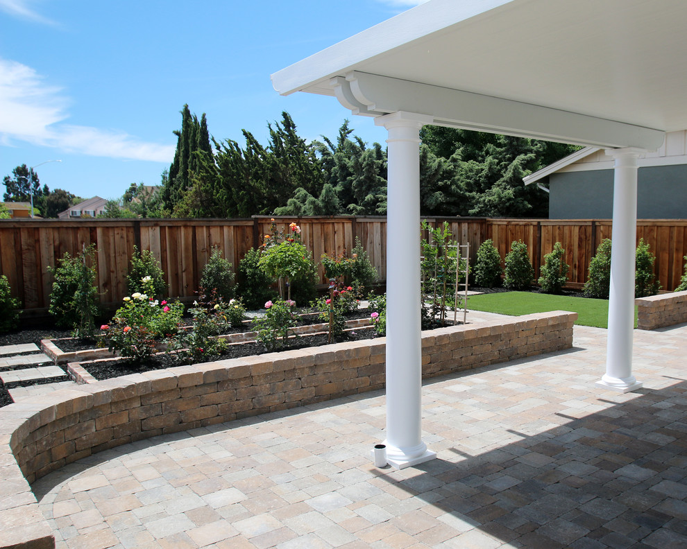 Design ideas for a mid-sized contemporary backyard full sun formal garden for summer in San Francisco with a garden path and concrete pavers.