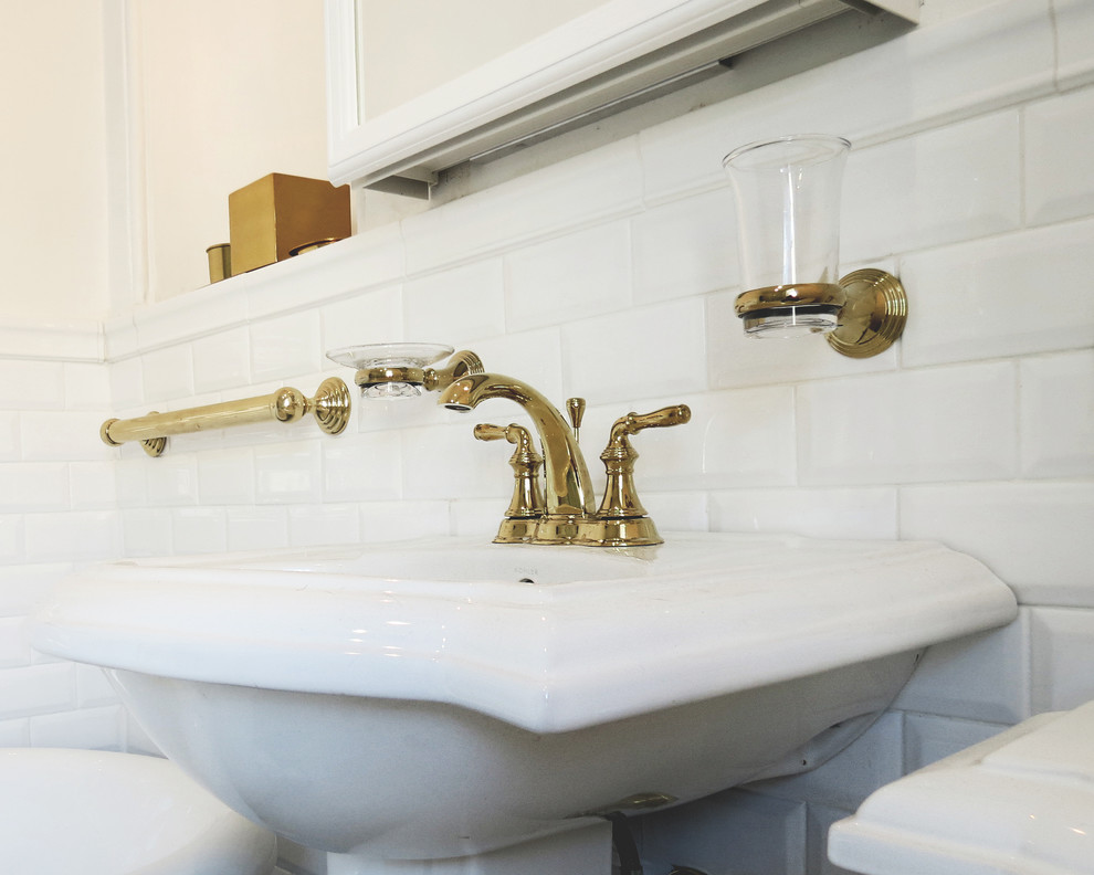 Photo of a mid-sized modern 3/4 bathroom in Philadelphia with a freestanding tub, a two-piece toilet, white tile, subway tile, white walls, a pedestal sink and white floor.