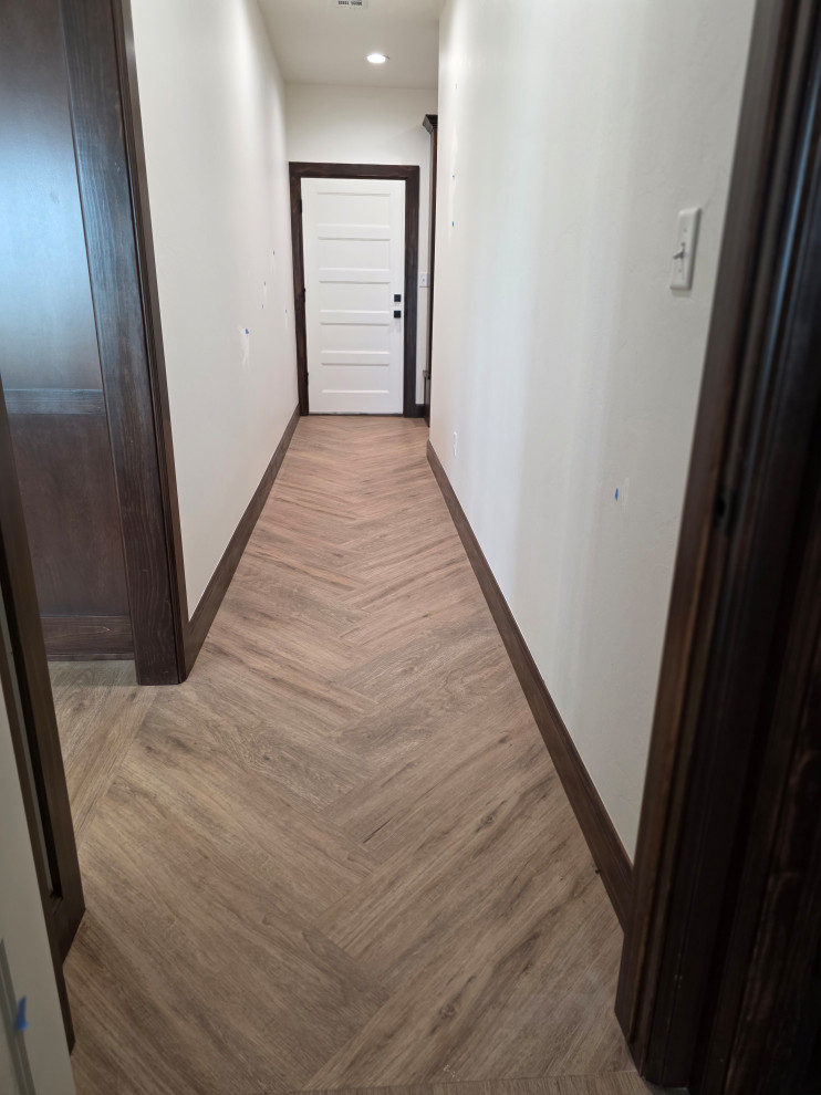 Hallway to Laundry Room in herringbone patterned floor