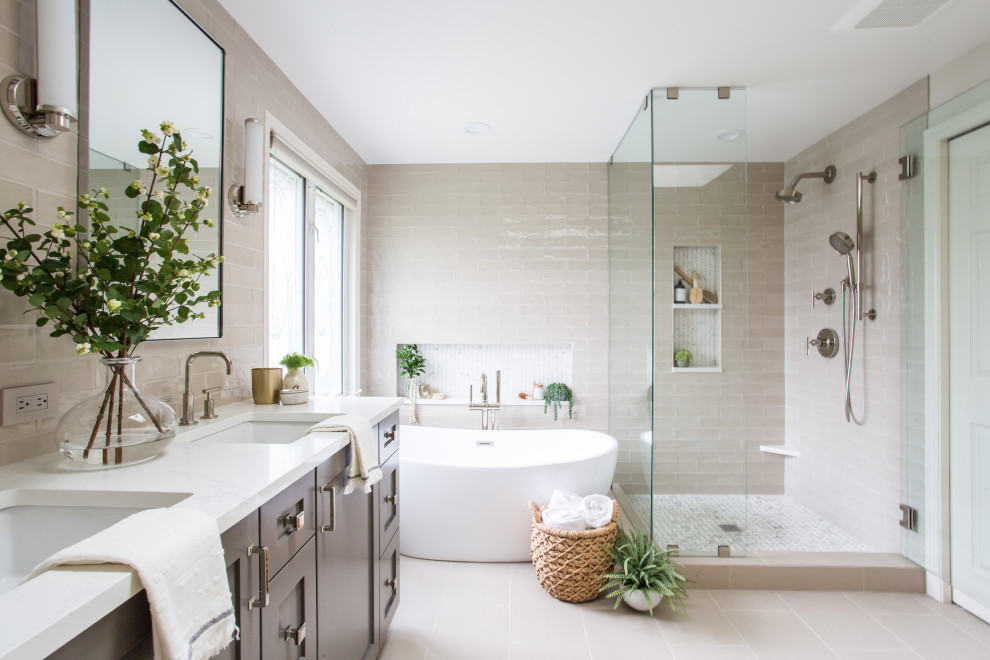 Freestanding bathtub - mid-sized transitional master gray tile and ceramic tile porcelain tile and double-sink freestanding bathtub idea in Seattle with shaker cabinets, gray cabinets, an undermount sink, quartz countertops, a hinged shower door, white countertops and a built-in vanity