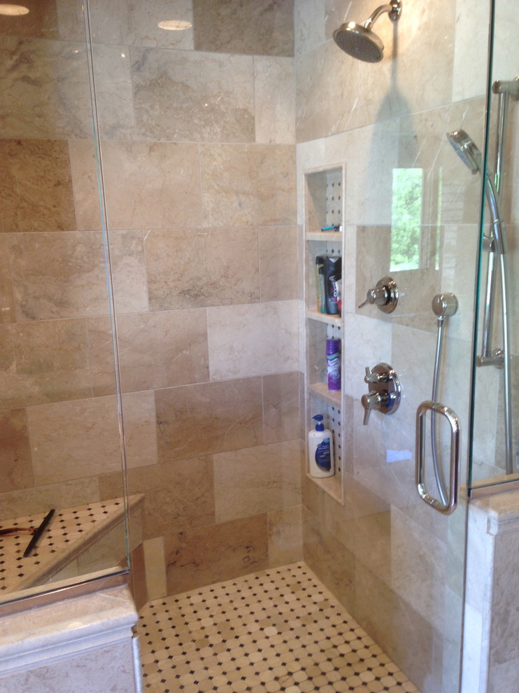 Freestanding bathtub - large transitional master beige tile and stone tile marble floor freestanding bathtub idea in Chicago with raised-panel cabinets, medium tone wood cabinets, quartz countertops, a two-piece toilet, an undermount sink and beige walls