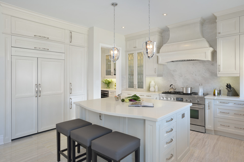Example of a large transitional l-shaped eat-in kitchen design in Toronto with an undermount sink, recessed-panel cabinets, white cabinets, marble countertops, gray backsplash, stone slab backsplash, stainless steel appliances and an island