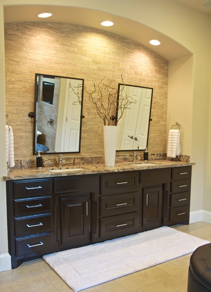 Mid-sized contemporary master bathroom in Dallas with raised-panel cabinets, dark wood cabinets, beige tile, ceramic tile, beige walls, ceramic floors, an undermount sink, granite benchtops, beige floor and beige benchtops.