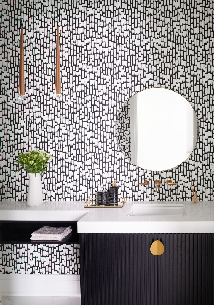 Design ideas for a mid-sized contemporary powder room in Toronto with furniture-like cabinets, black cabinets, a wall-mount toilet, black walls, porcelain floors, an undermount sink, solid surface benchtops, white floor, white benchtops, a built-in vanity and wallpaper.