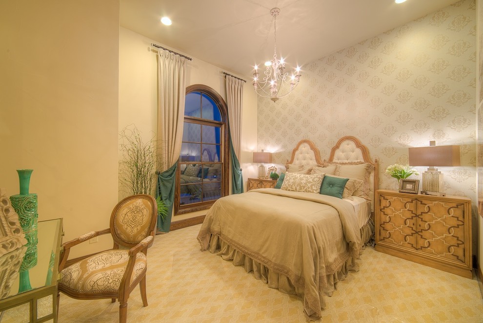 Design ideas for a mid-sized mediterranean guest bedroom in Austin with beige walls, carpet and beige floor.