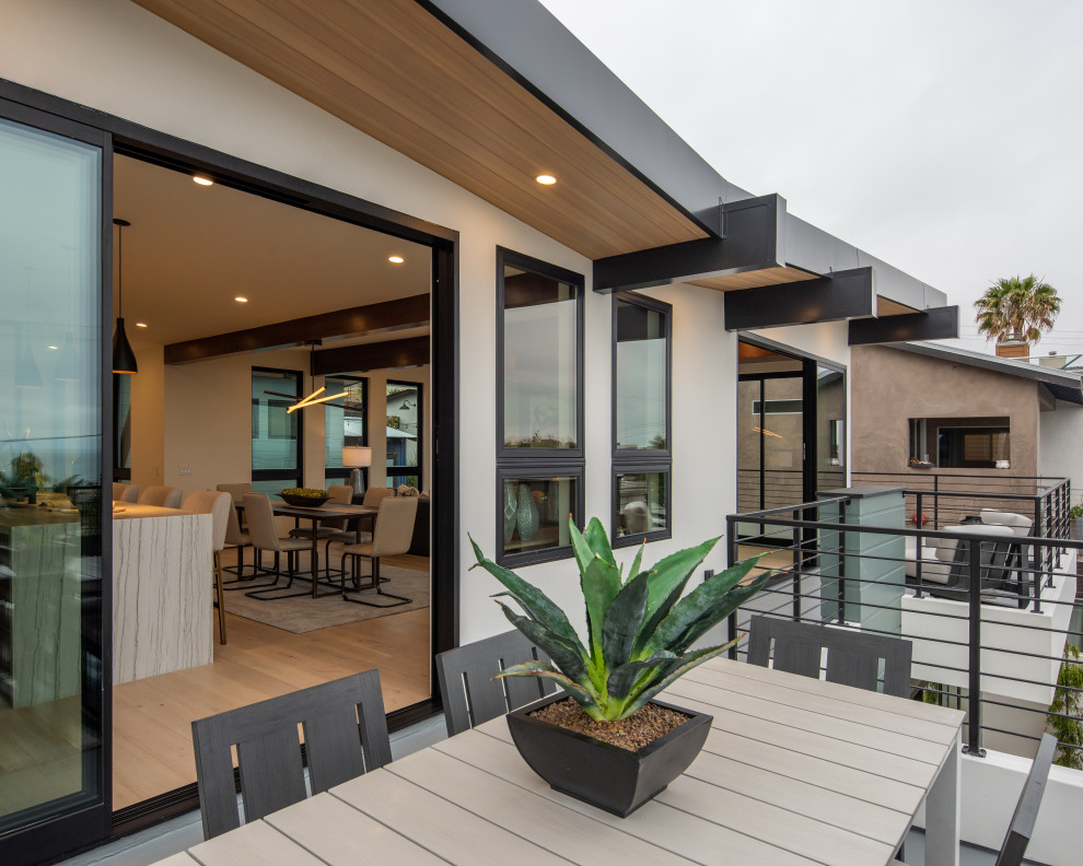 Mid-sized modern rooftop deck in San Diego with a container garden and a roof extension.