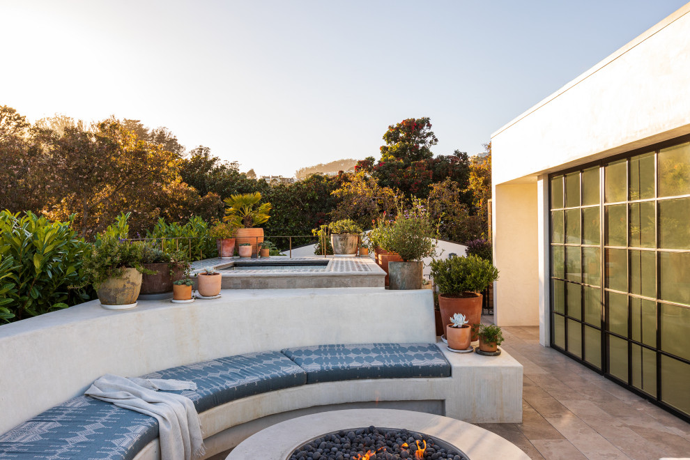Inspiration for a modern rooftop rooftop deck remodel in San Francisco with a fire pit and no cover